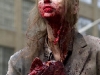 A zombified extra holds a prop limb, "The Walking Dead" June 14, 2011